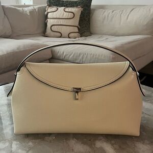 TOTEME T-lock textured leather milk grain handbag